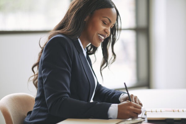 A professional making a 3-item to-do list